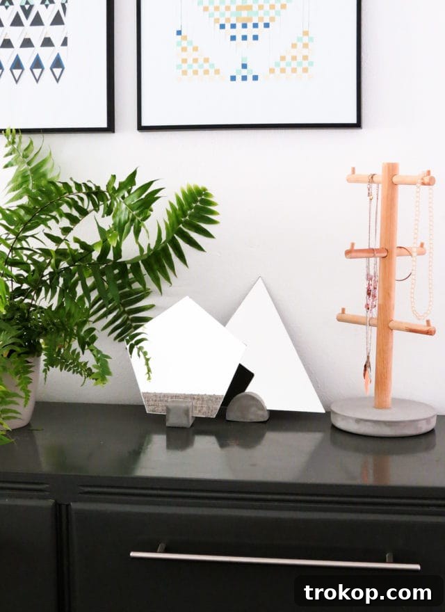 Stylish DIY Concrete Vanity Mirror by Ashley Rose of Sugar & Cloth, perfect for modern homes.