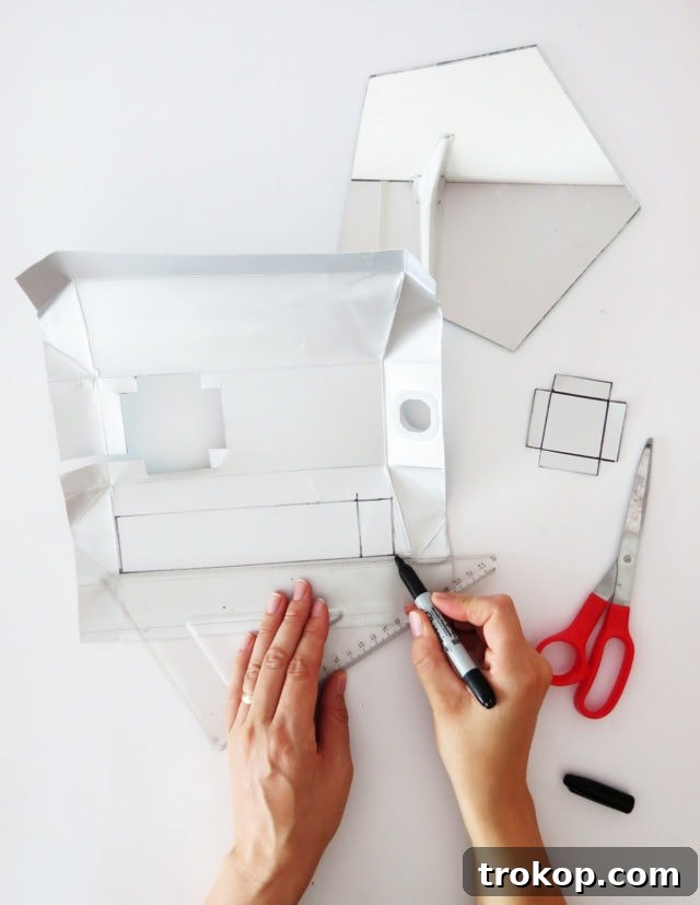 Cutting and folding the mold pieces for the concrete mirror base.
