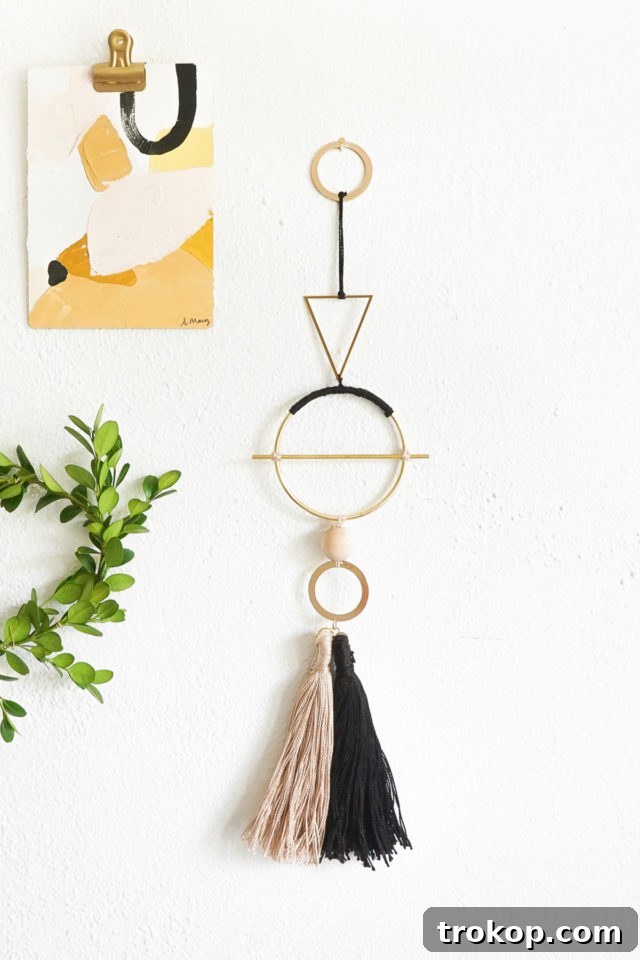 Close-up of DIY Geometric Metal Wall Hang, highlighting brass and flossing details