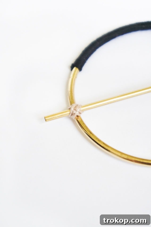 Step 2 & 3: Attaching the gold bar to the hoop with flossing in an X-pattern
