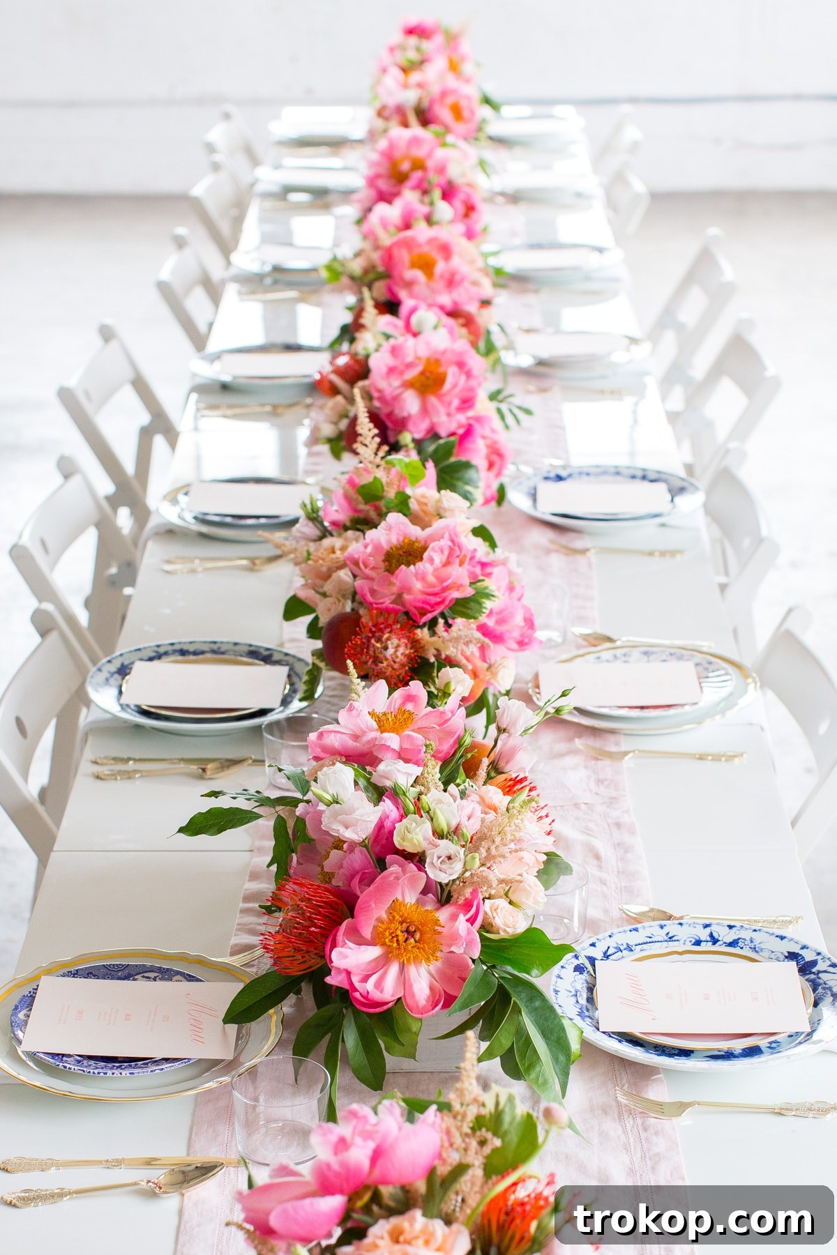 Elegant bridal shower place setting with Minted menus and pink runners