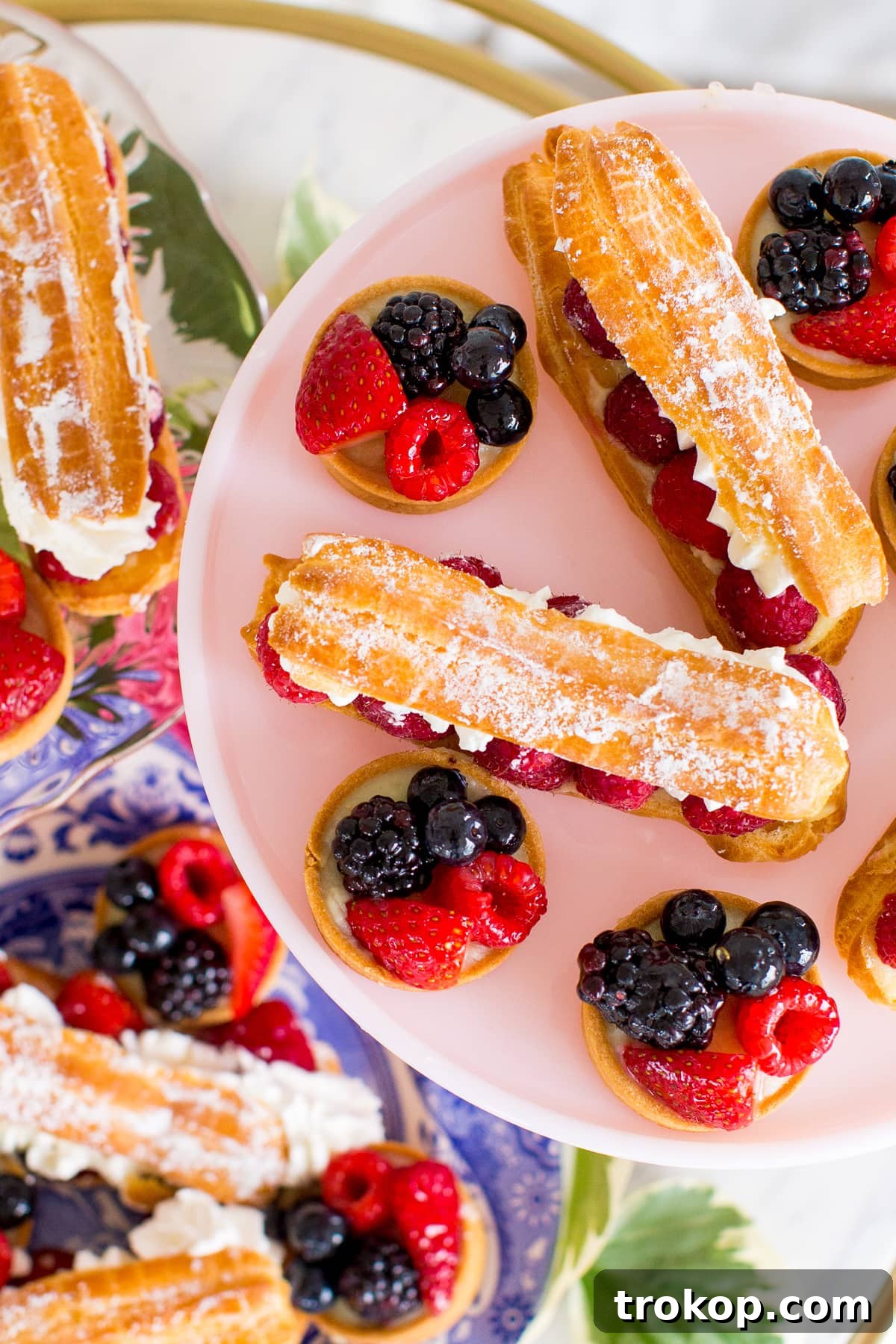 Close-up of vintage gold flatware and layered plates for a bridal shower