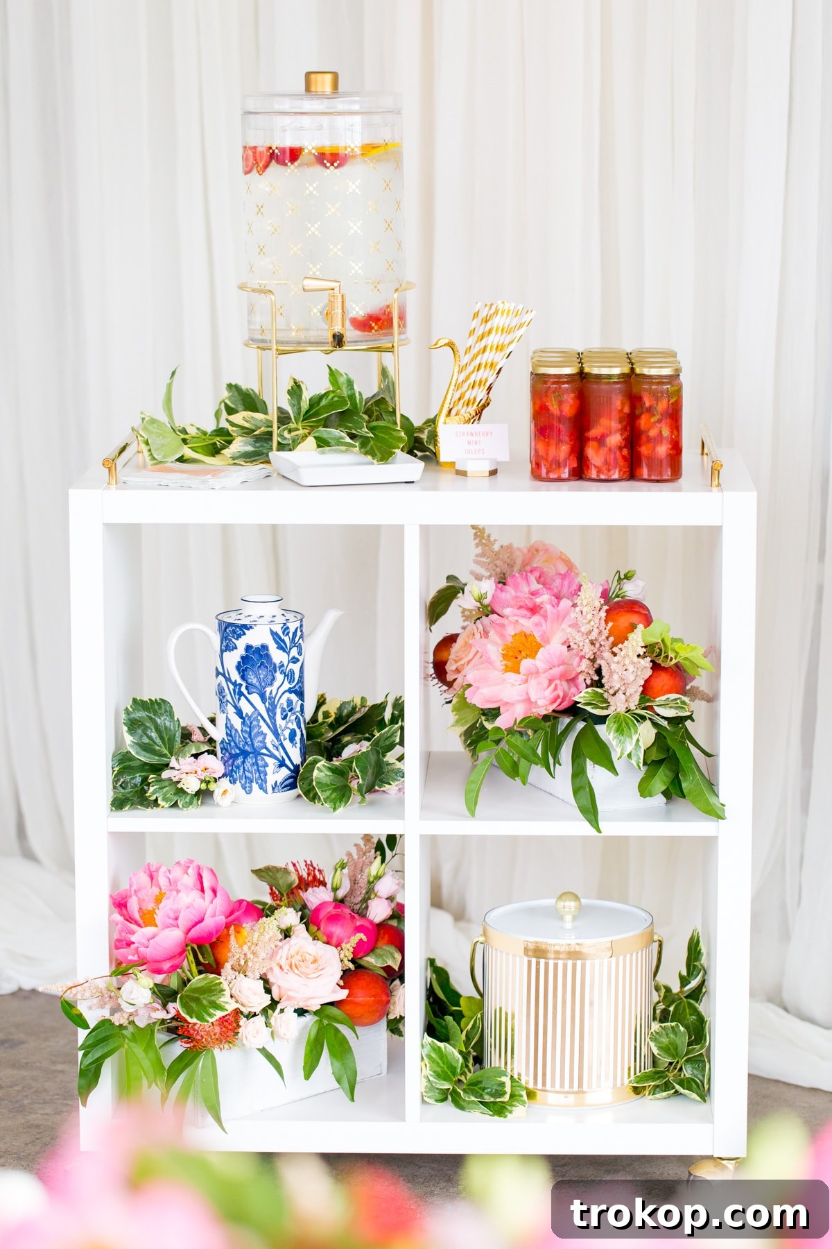 Lush floral arrangement with peaches and Proteas for a bridal shower