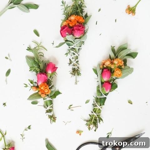 A photo of 3 sage bundles with flowers and scissors, highlighting the finished product and crafting tools.