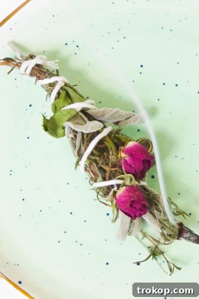 A close-up of how to wrap an incense bundle, detailing the intricate crisscross pattern with twine for secure bundling.