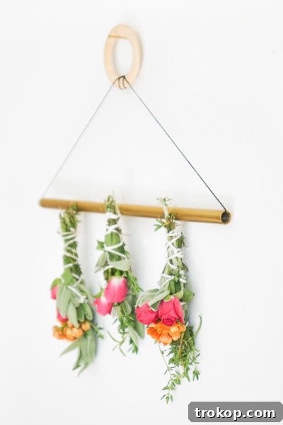 A side photo of how to dry sage bundles on a wall hanger, demonstrating the final step before use.