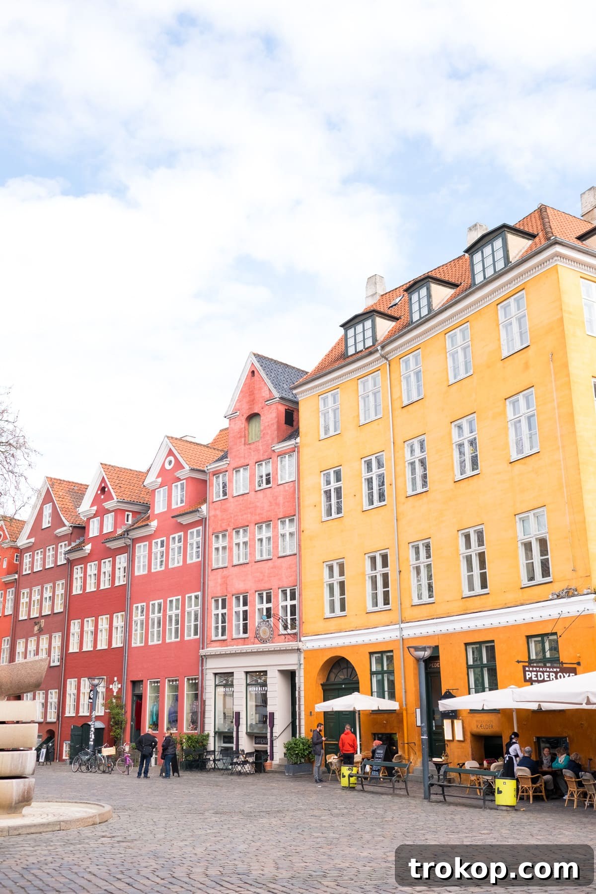 Copenhagen, Oslo & Berlin: A Nordic and German Journey 9 Colorful buildings lining a canal in Copenhagen, a vibrant and iconic cityscape