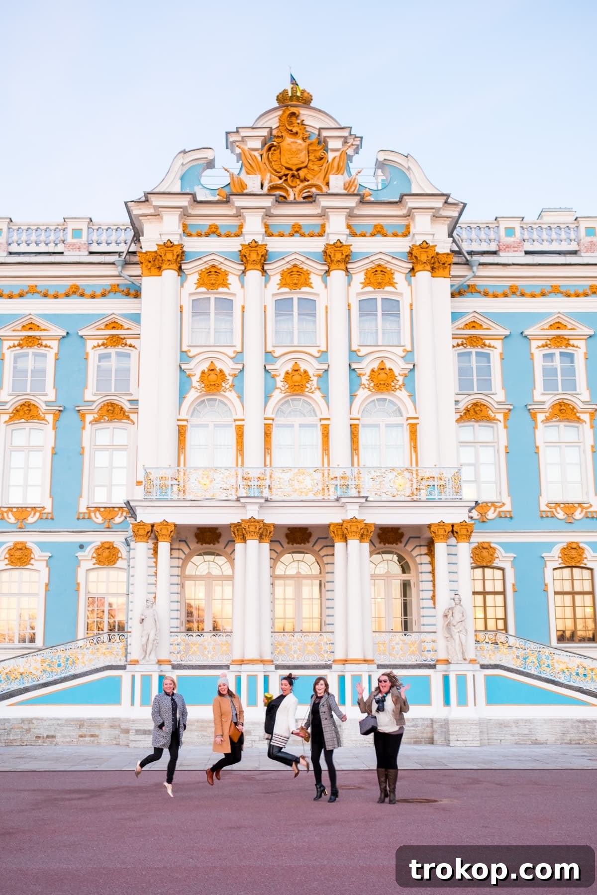 Friends posing in a grand hall of a Russian palace