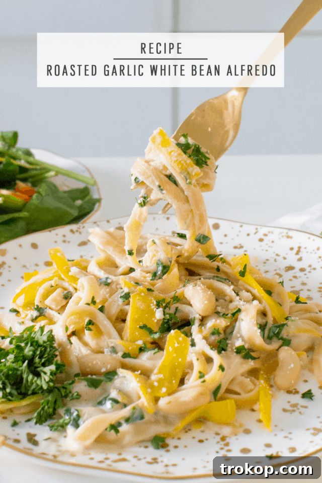 A beautifully arranged serving of Roasted Garlic White Bean Alfredo, showcasing its delicious appeal.