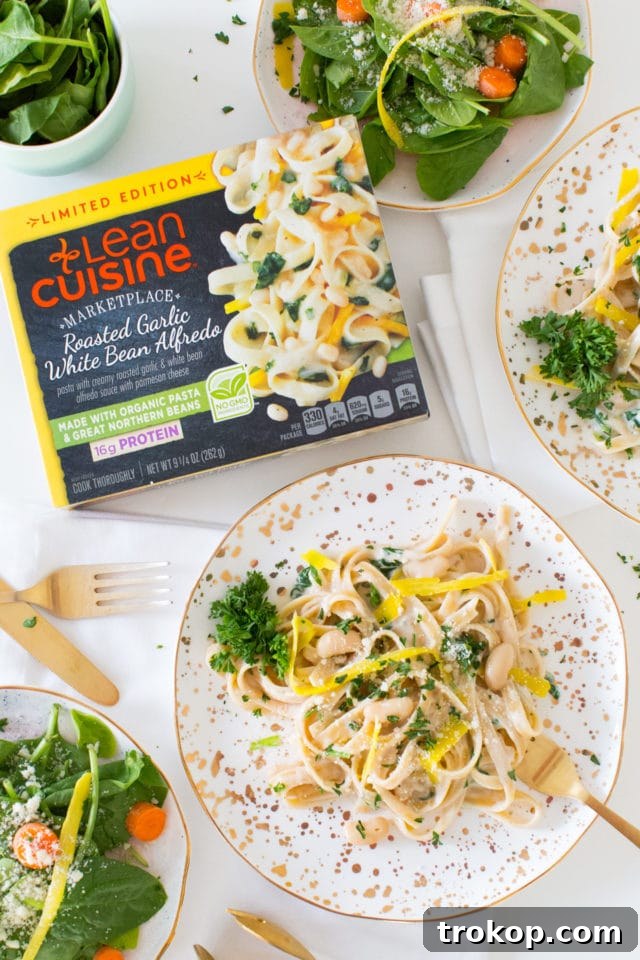 Another enticing view of the finished Roasted Garlic White Bean Alfredo pasta, showcasing its texture and presentation.