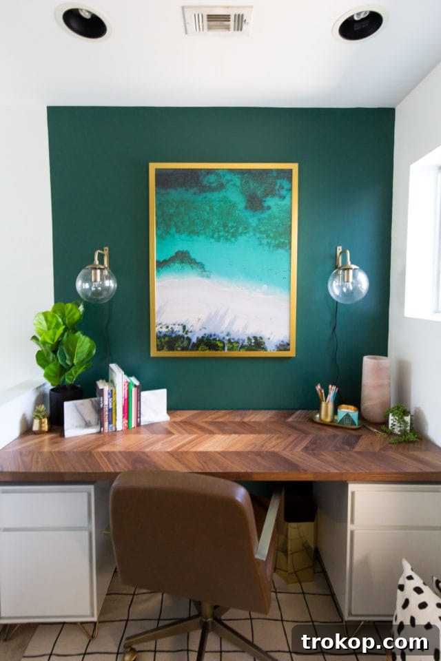 New modern herringbone desktop installed in the home office nook, contrasting with the green wall