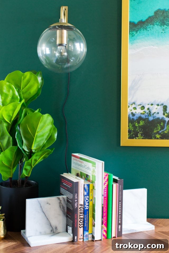Framed drone shot from Harbour Island hanging above the desk, blending with the green accent wall