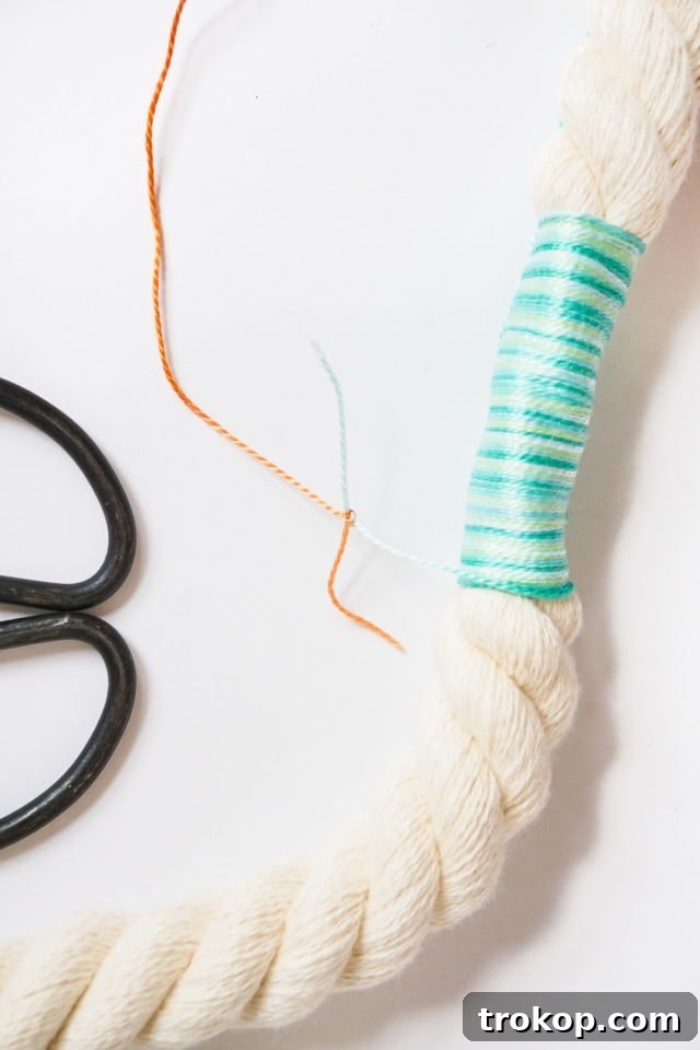 Step 2: Marking the rope and beginning to wrap with the first color string