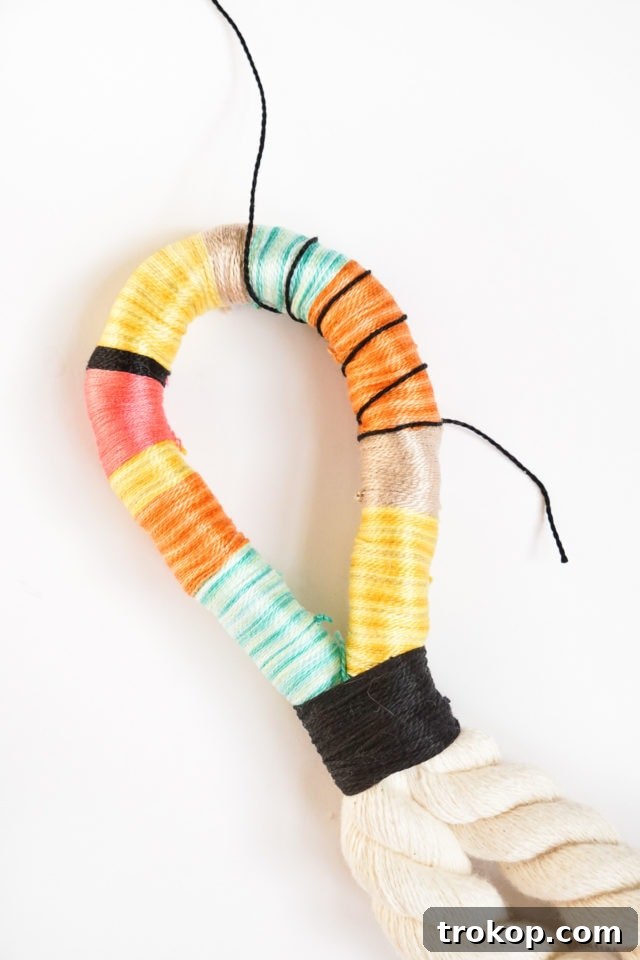 Step 4: Forming the loop and securing it with a contrasting string wrap