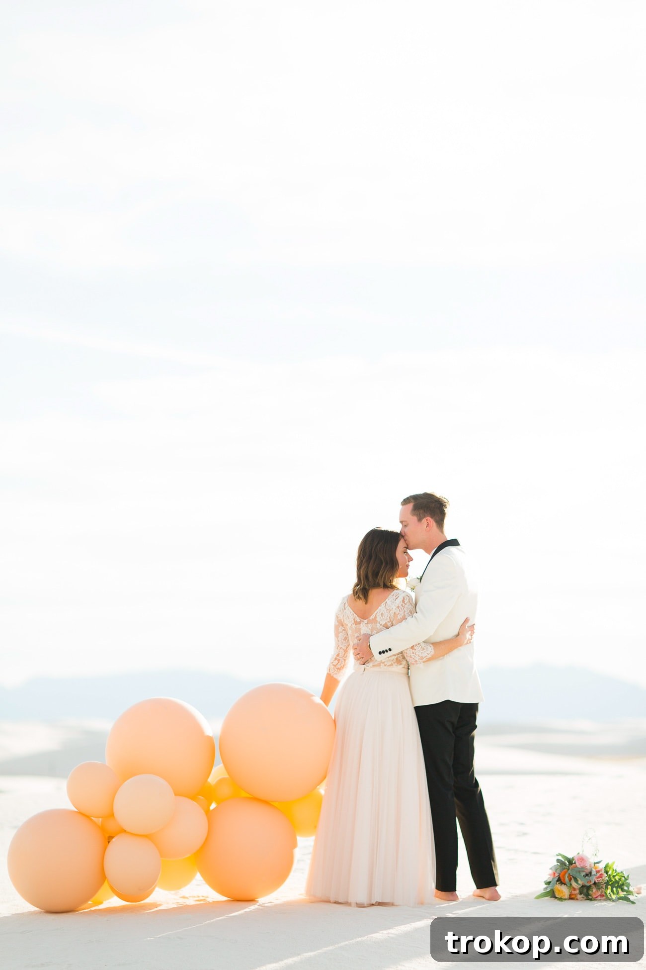 The happy couple exchanging rings during their White Sands elopement