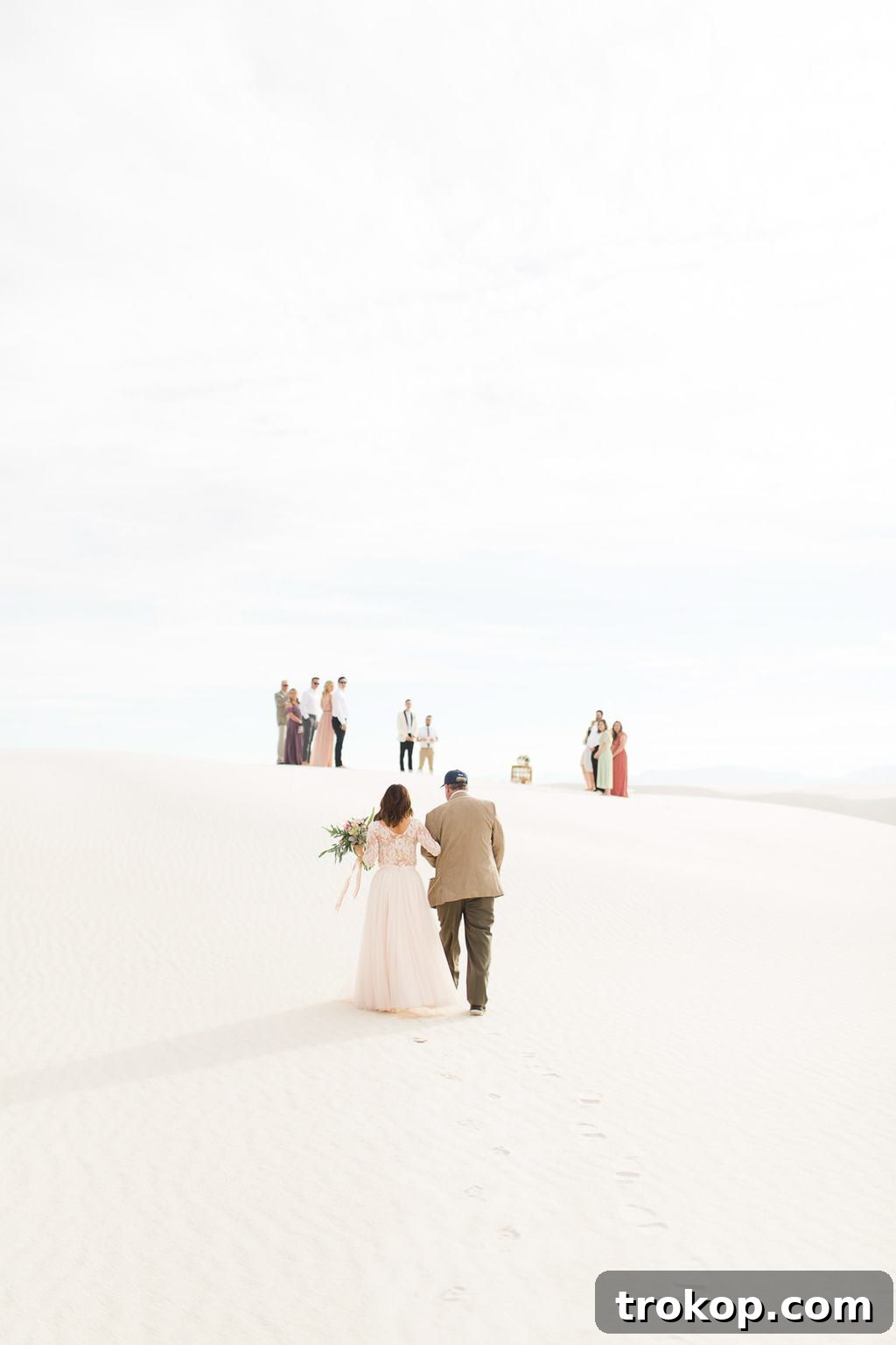 Bride and groom's emotional embrace during their White Sands wedding