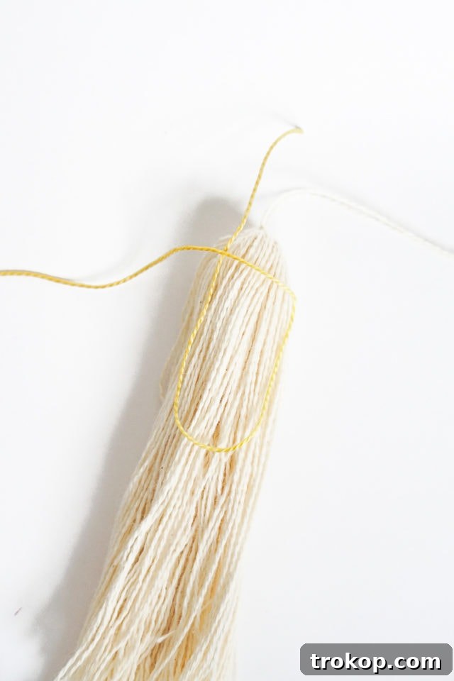 DIY Tasseled Throw Pillows by Ashley Rose of Sugar & Cloth, a top lifestyle blog in Houston, Texas