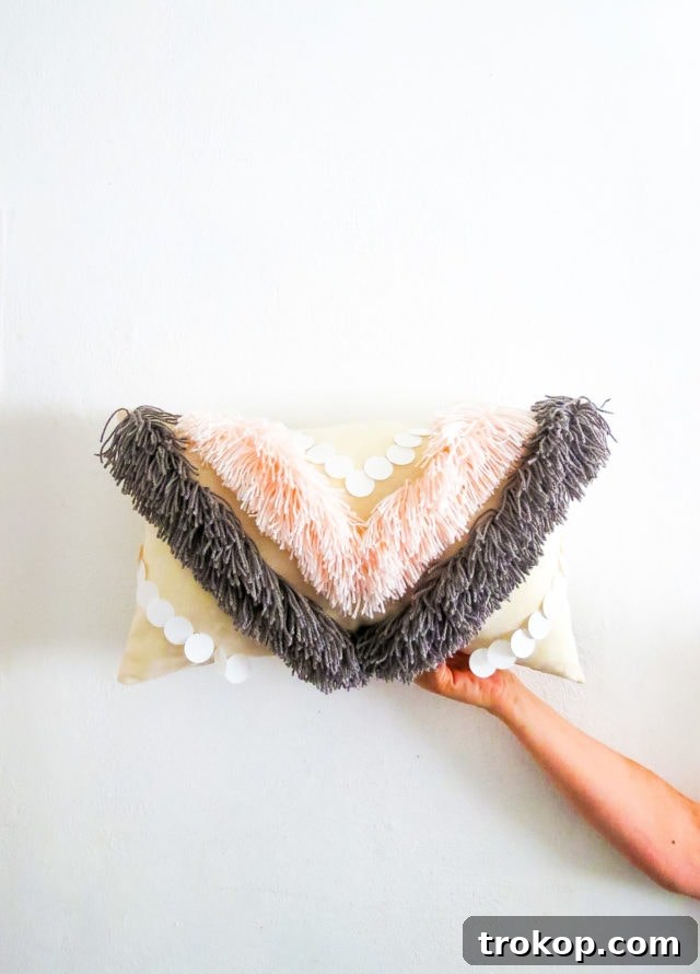Boho Yarn Fringe Pillow Project 15 DIY Yarn Fringe Throw Pillow styled with a textured throw blanket