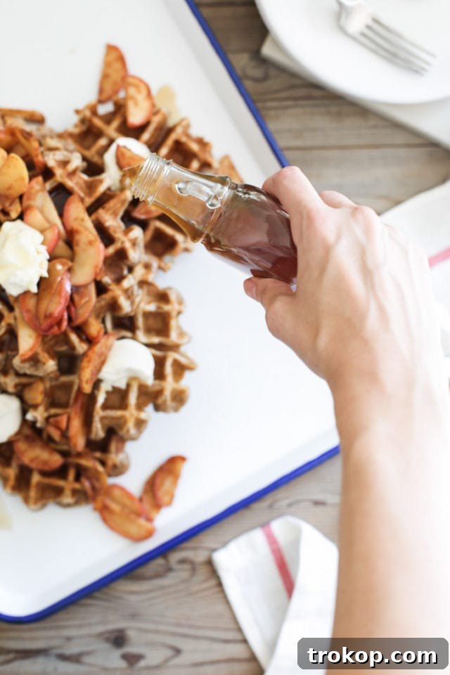 Bourbon-Glazed Spiced Apple Cinnamon Waffles 6 Spiced Apple Cinnamon Waffles served with whipped cream and bourbon syrup