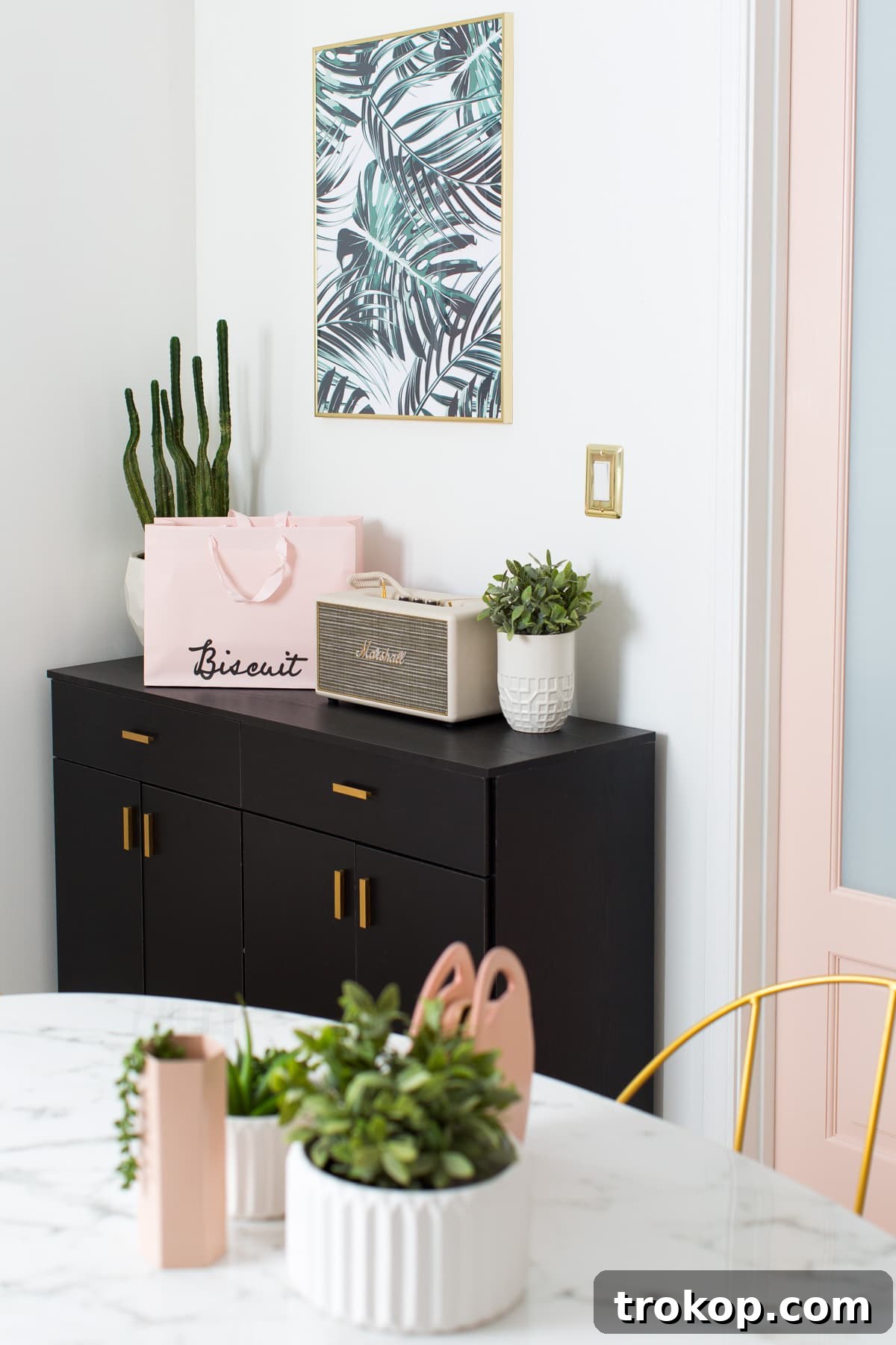 Our New Studio Meeting Room Makeover Revealed 13 Meeting room details with gold accents and decorative books