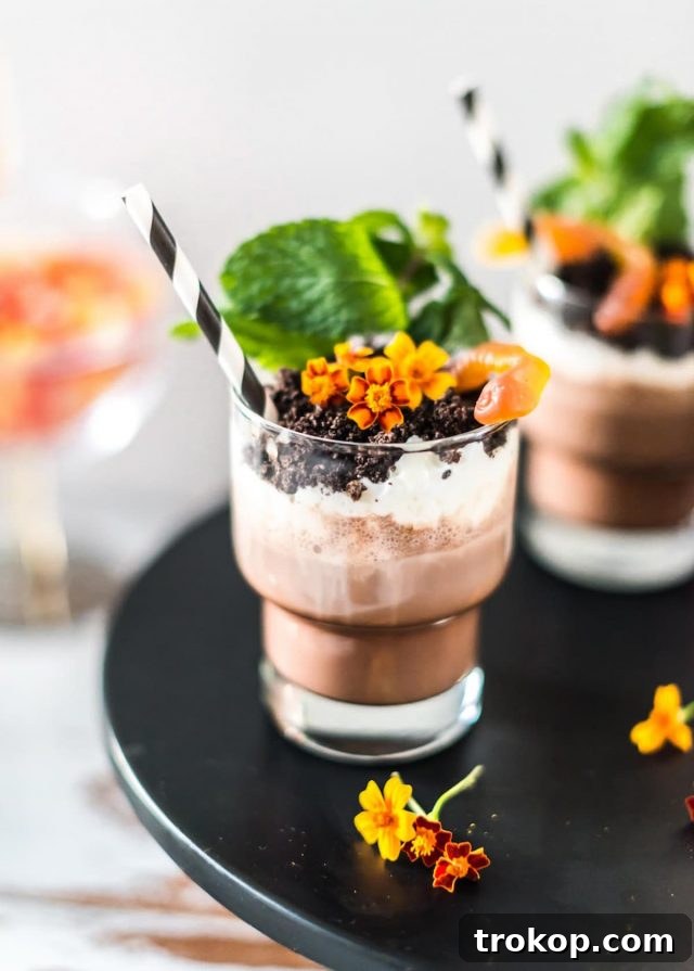 Photo of edible flowers on a dirt dessert recipe with booze