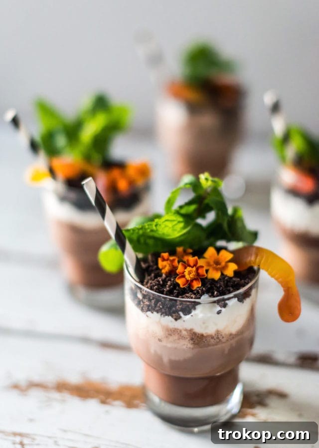 A Boozy Dirt Cup with Halloween decor in the background