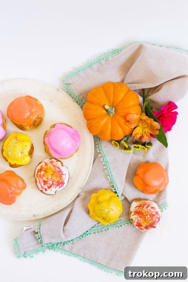 Pumpkin Spice Cream Puffs 12 A plate of golden Pumpkin Pie Cream Puffs with delicate glaze