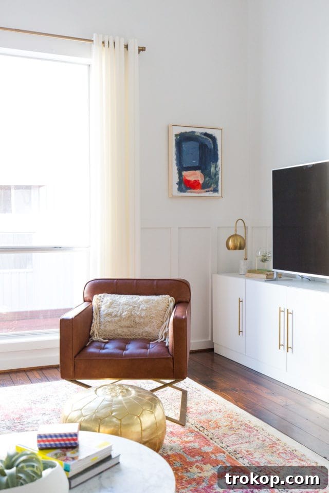 Our Townhouse Living Room Reimagined 6 Spacious Living Room Rug Anchoring Sectional and Furniture