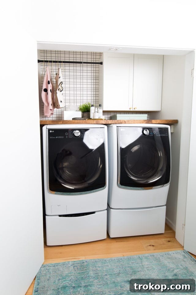 Our small laundry room before the exciting renovation project began, showcasing the original setup
