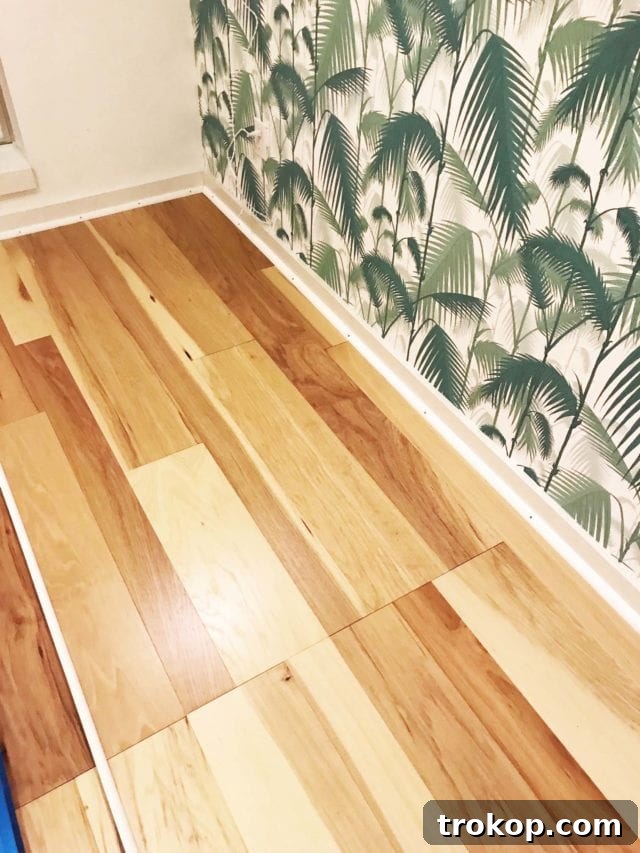 Close-up of the disastrous flooring installation, revealing a giant visible seam down the middle