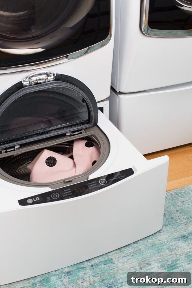 The new LG front-load washer and dryer with pedestal drawers, enhancing efficiency