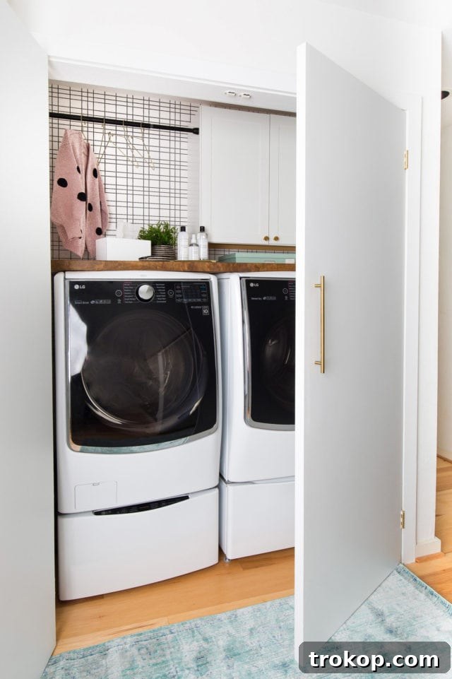 Details of the stylish black and white grid wallpaper and the custom butcher block countertop