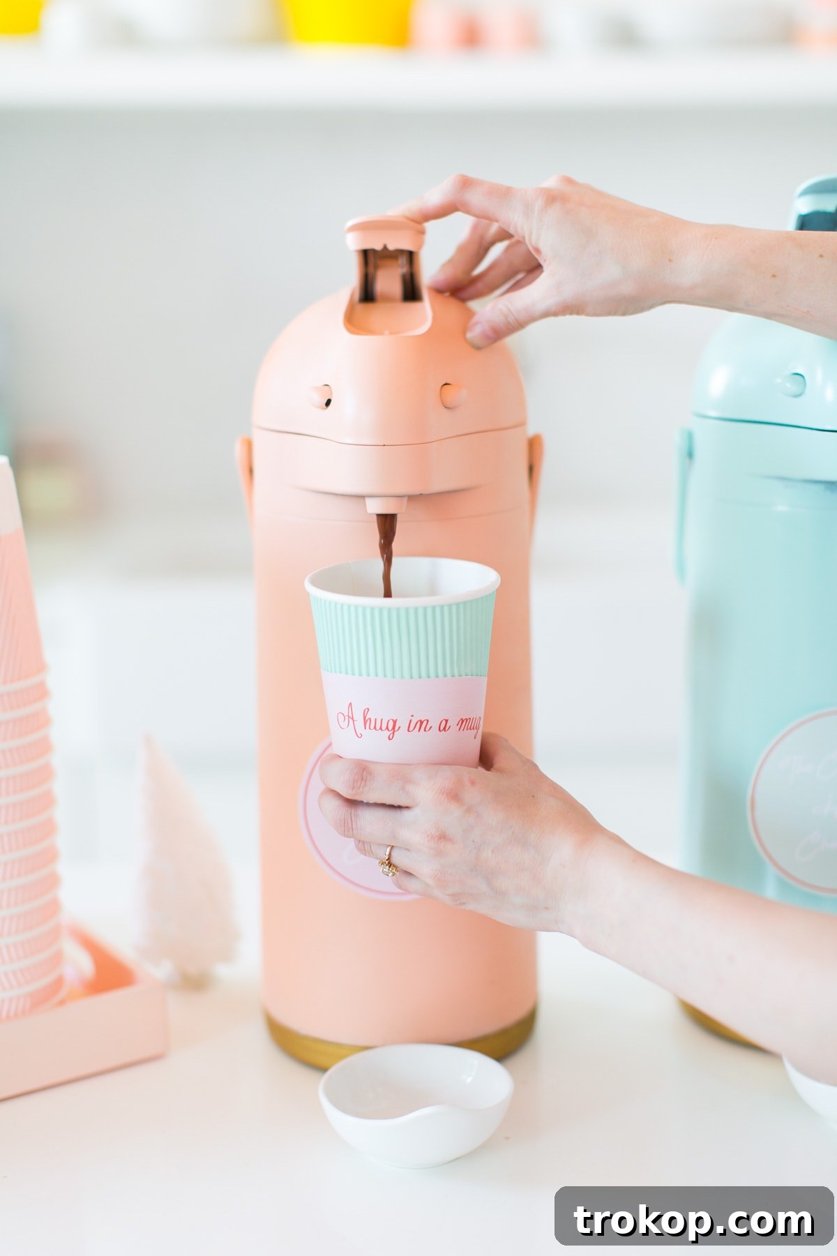 Cocoa & Compassion: Our Holiday Charity & Hot Chocolate Bar Wrap-Up 2 A beautifully decorated DIY Hot Chocolate Bar at a holiday charity event, featuring colorful carafes and festive treats. Perfect for winter gatherings.
