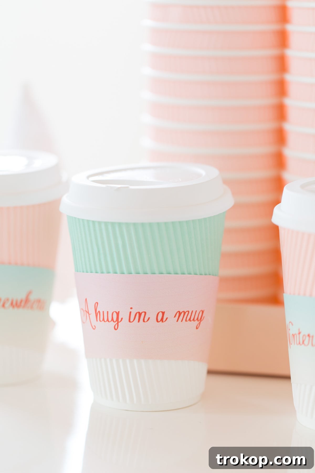 Cocoa & Compassion: Our Holiday Charity & Hot Chocolate Bar Wrap-Up 9 Close-up of the customized hot chocolate carafes in various pastel colors with gold accents, ready for serving.