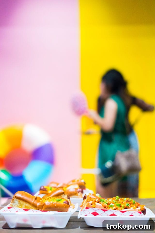 Sugar and Cloth's Colorful New Wall Debut Party Highlights 6 Attendees Mingling and Celebrating at the Color Wall Grand Opening