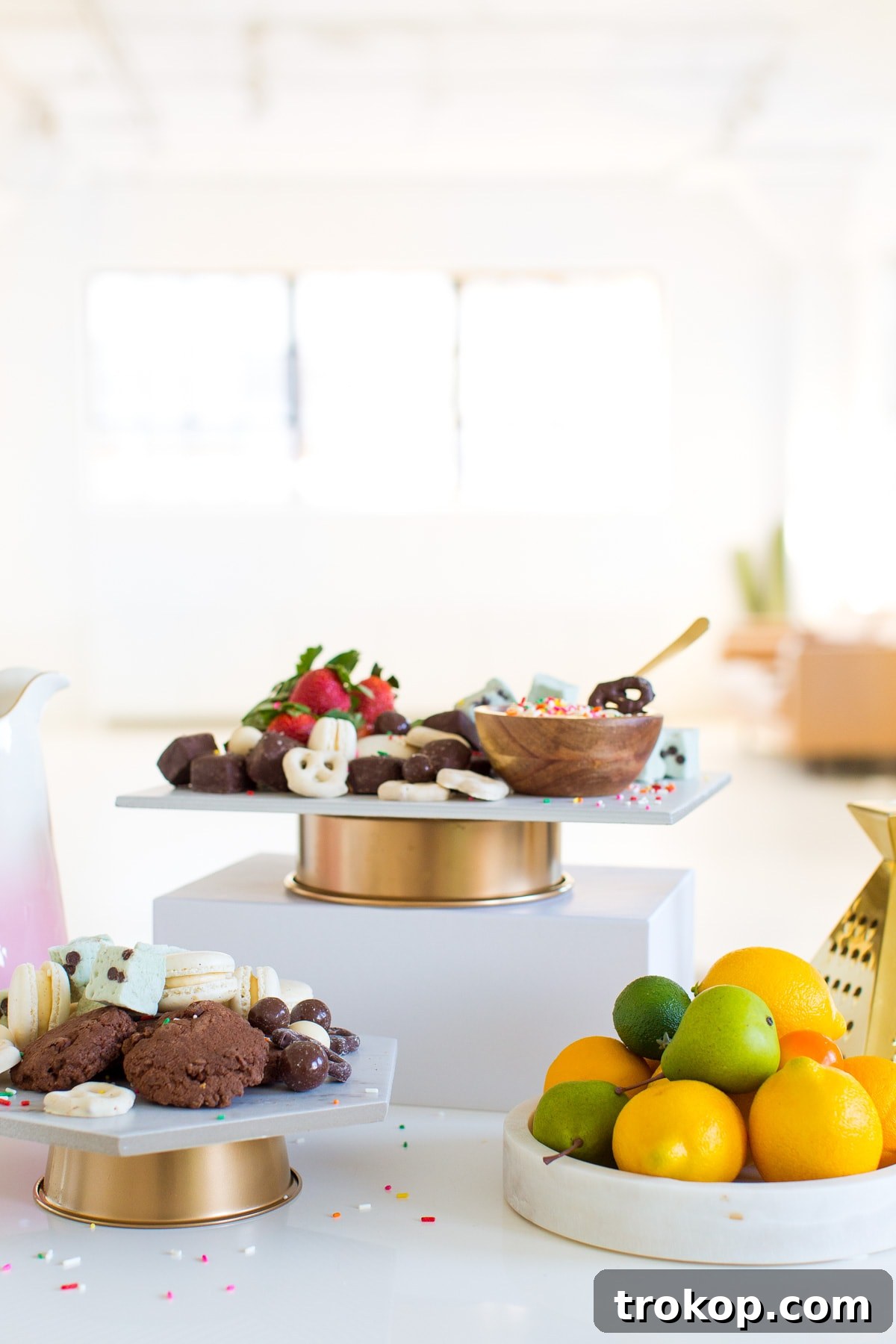 DIY Marble & Gold Serveware by top Houston lifestyle blogger Ashley Rose of Sugar and Cloth showcasing an elegant display of sweets and fruits