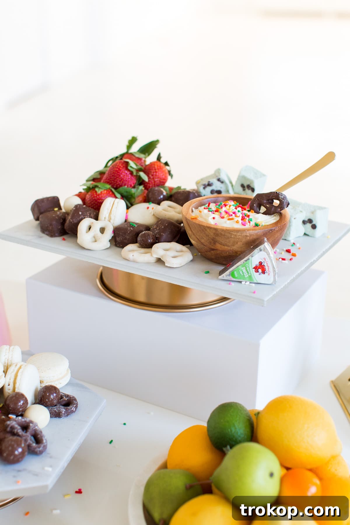 Variety of sweets displayed on DIY Marble & Gold Serveware for a party