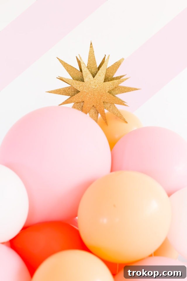 Side view of a festive balloon garland tree