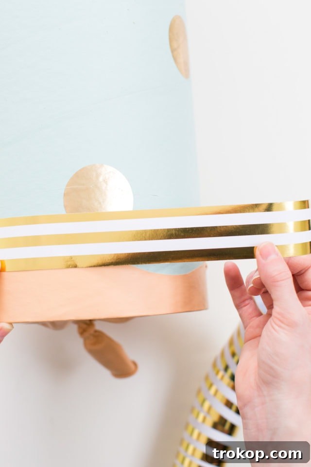 Epic DIY Confetti Blasts 11 Adding decorative gift wrap trim where the balloon meets the tube