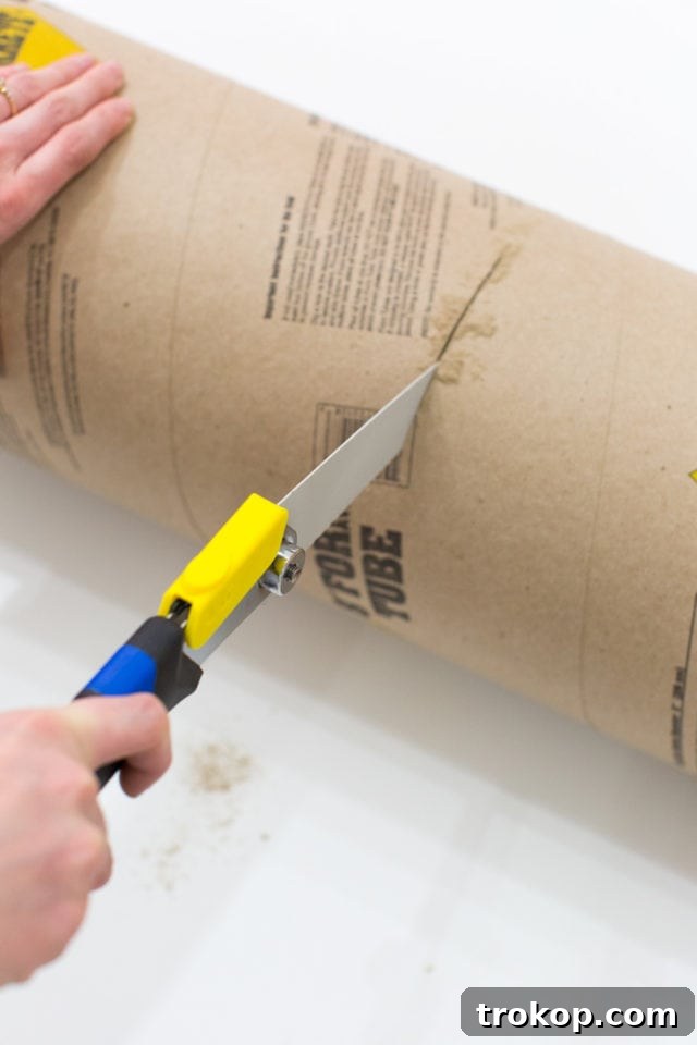 Epic DIY Confetti Blasts 5 Cutting a cardboard tube form in half for confetti poppers