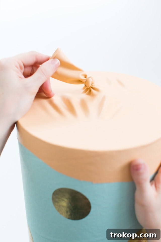 Epic DIY Confetti Blasts 10 Tying a knot at the end of the balloon to create a handle for the confetti popper