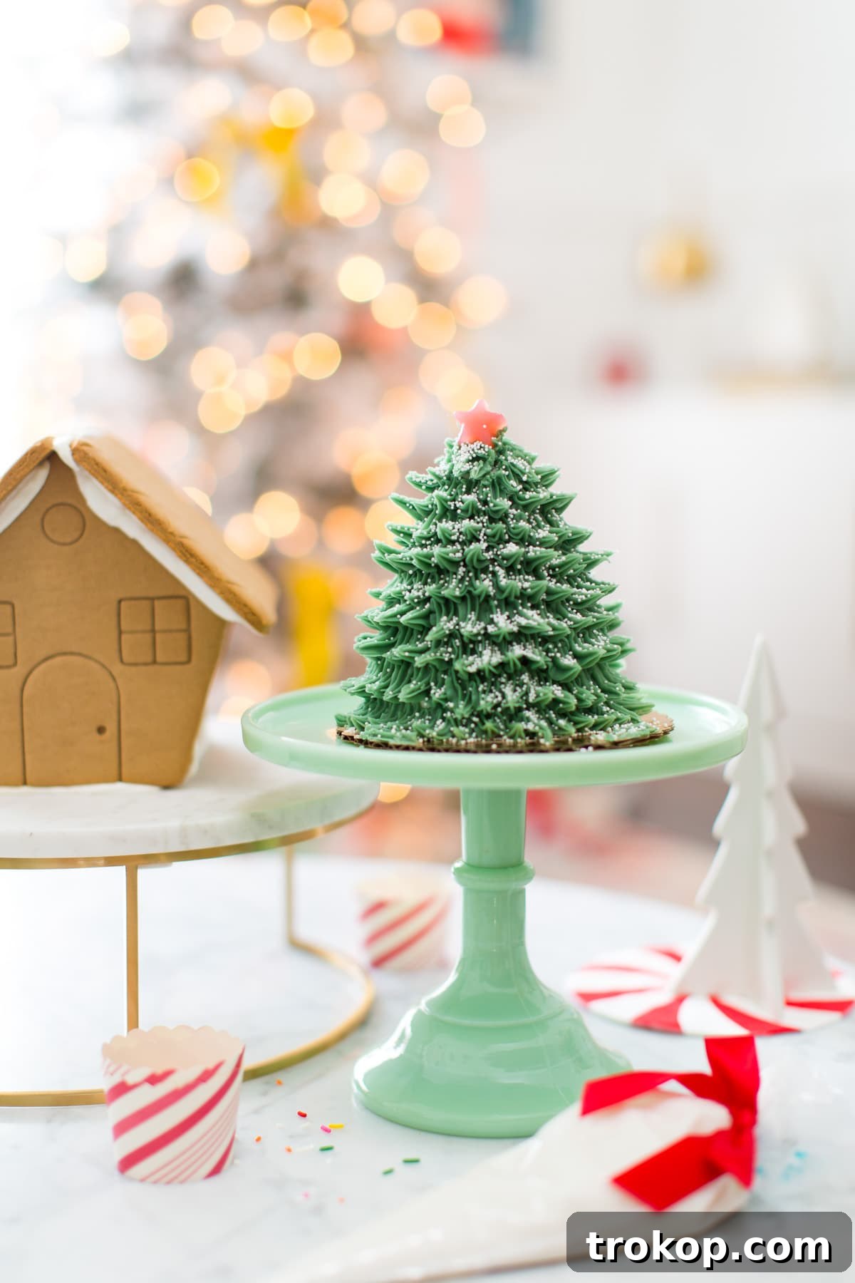 Christmas living room with a flocked tree, garlands, and personalized stockings