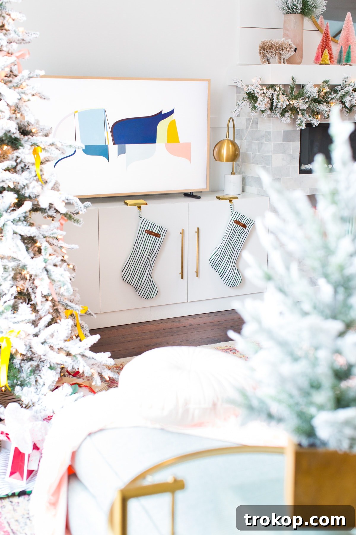 Decking the Halls Our Way 8 Elegant Christmas fireplace mantel decorated with garland and stockings