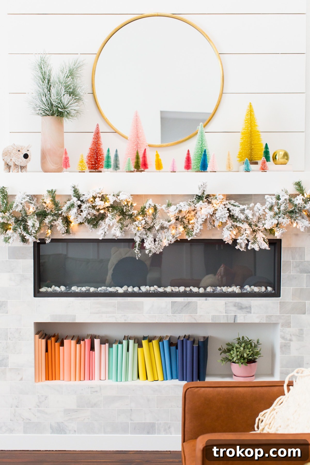 Decking the Halls Our Way 10 A festive Christmas living room corner with a flocked tree and cozy lighting