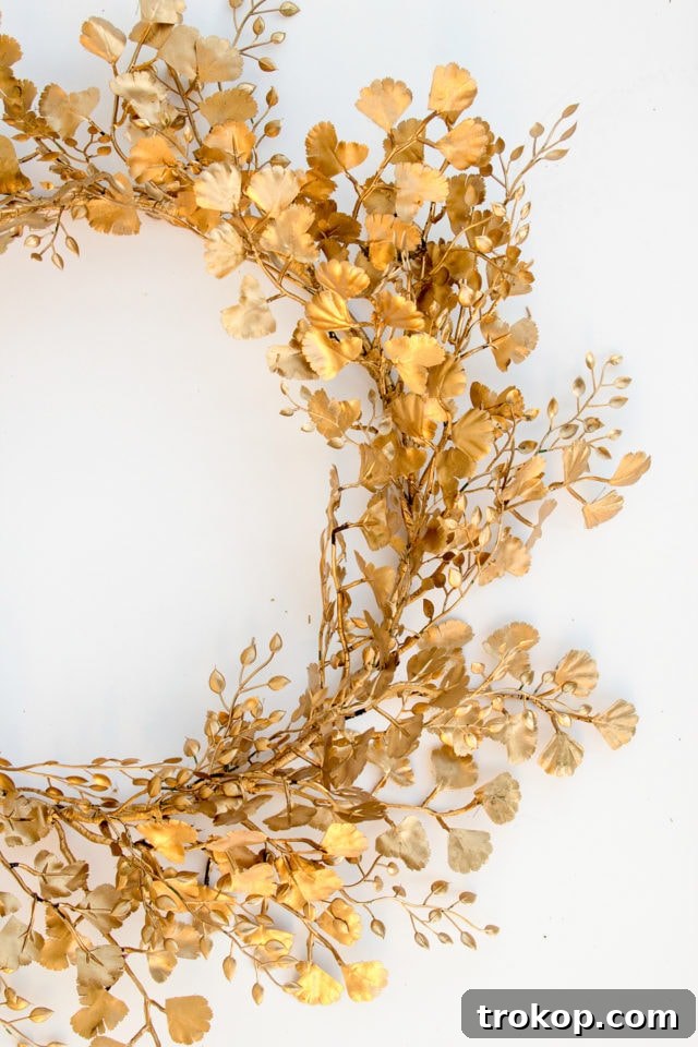Shimmering Gold DIY: Wreaths & Garlands 12 Finished DIY Gold Wreath after spray painting, with leaves adjusted for a seamless, full appearance.
