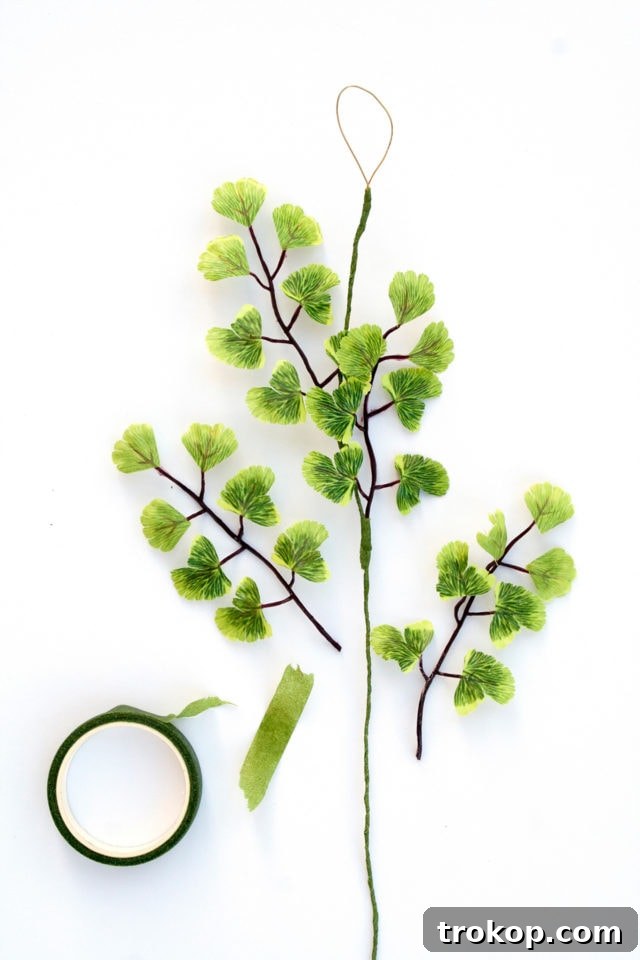 Shimmering Gold DIY: Wreaths & Garlands 13 Step-by-step process of attaching individual leaves to a floral-taped wire to create a DIY Gold Garland.