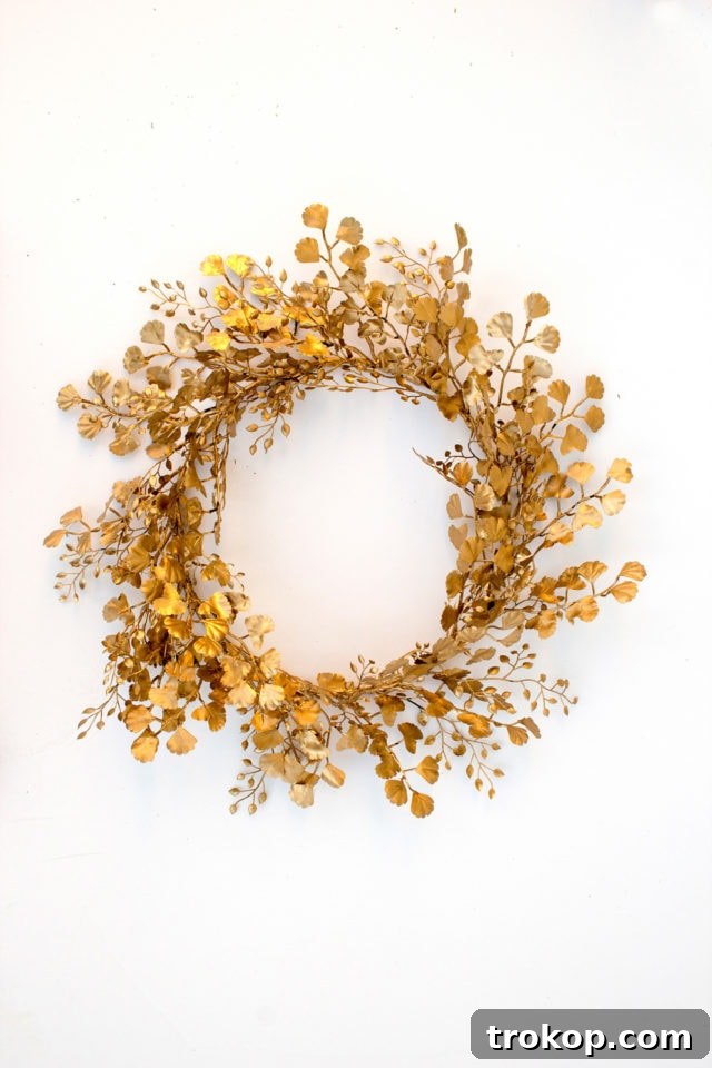 Stunning close-up of the finished DIY Gold Wreath, highlighting the delicate golden leaves and intricate design.