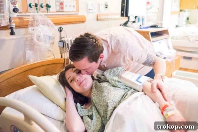 Little Sugar and Cloth Gwen's Birth Journey 2 Pregnant woman smiling, embracing her belly in a warm, natural setting.