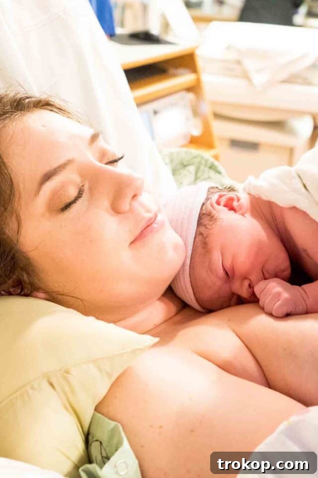 Little Sugar and Cloth Gwen's Birth Journey 5 Newborn baby's tiny hands holding an adult's finger, symbolizing new life and connection.