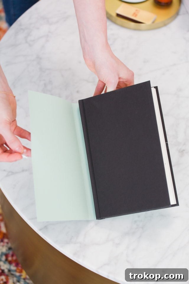 Vibrant Bookcase Transformation 4 how to make a DIY cover - fake books for bookshelf